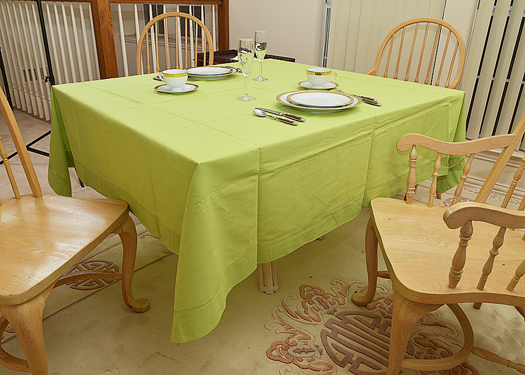 Happy Festive 70" square tablecloth. Macaw Green
